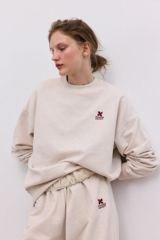 The New Society Sweater met Logo Sand Vigore